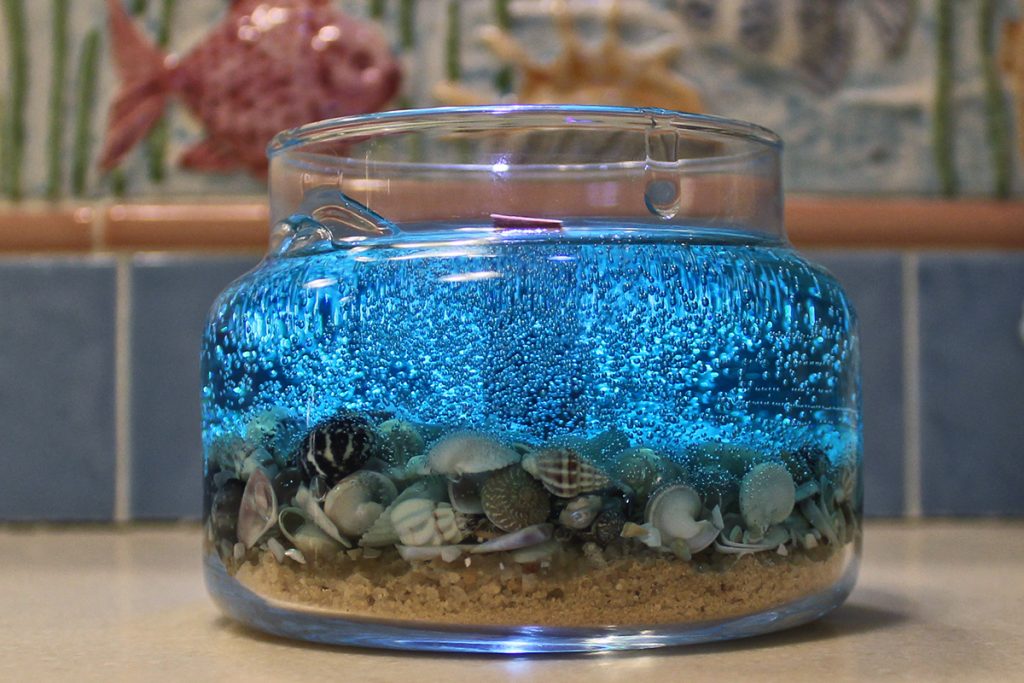 Tahitian Teal Ocean Classic Scented Shell Candle Illuminated View